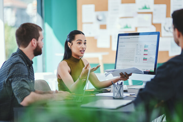 Creative, business people and team discussion with documents in meeting for brand or target audience. Group, campaign manager and planning with chart for ads, performance data or strategy in startup.