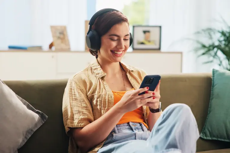Woman on phone listening to podcast